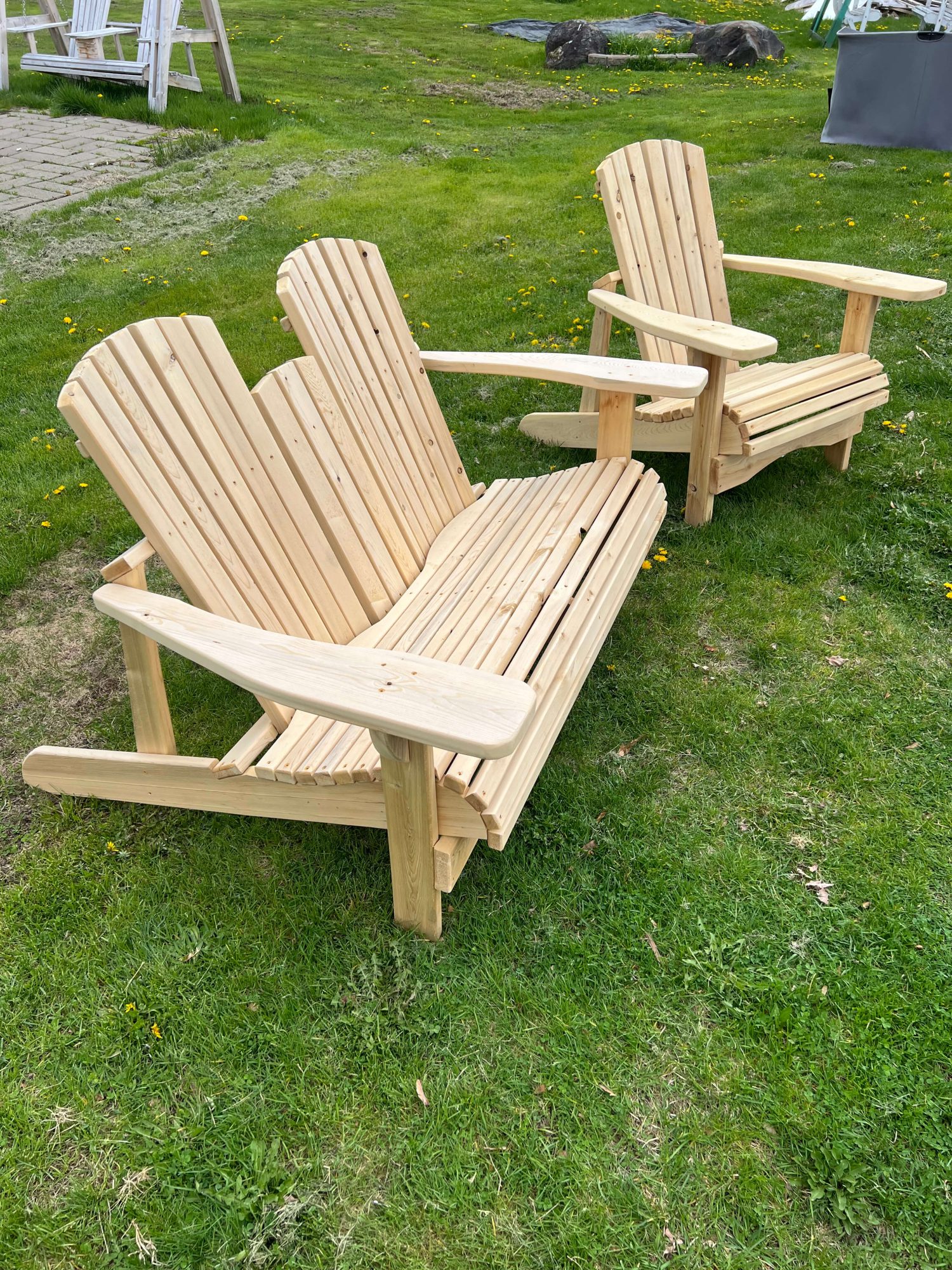 Cedar Adirondack chair on a lush green lawn